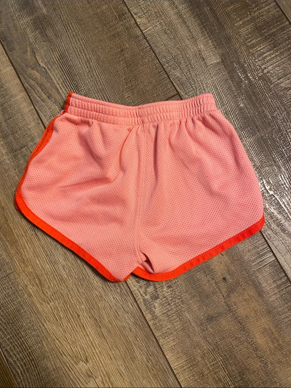 Nike Women’s Pink Athletic Mesh Shorts with Orange Trim